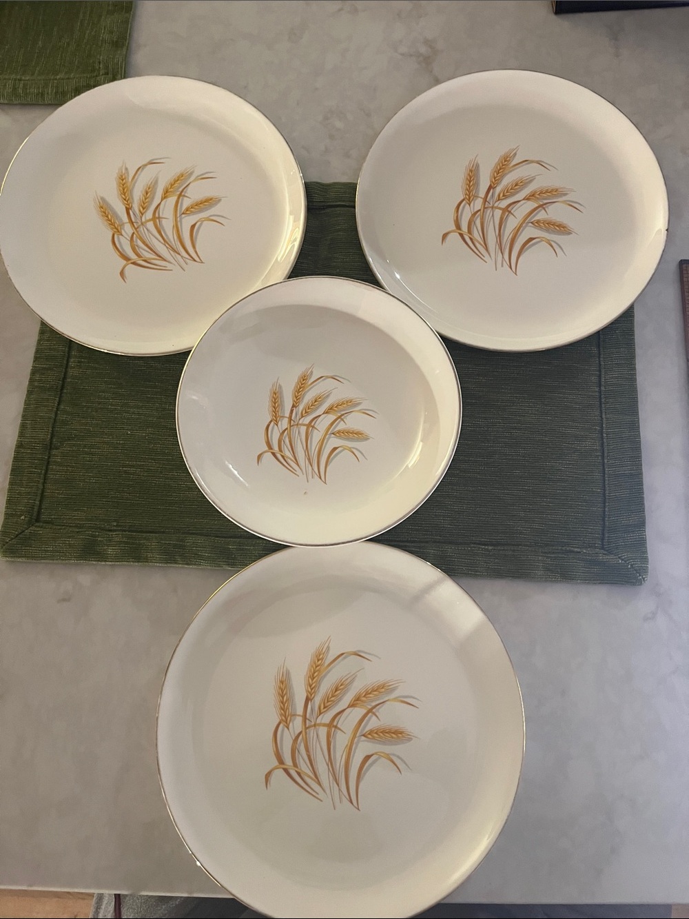 Vintage pieces of 4 Homer Laughlin Golden Wheat plates and a bowl 22K Gold Trim